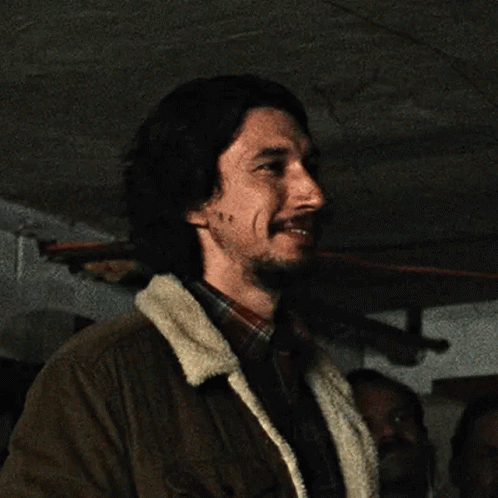 Bearded Man In Brown Jacket And Plaid Shirt Smiling GIF