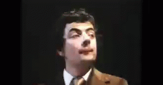 Bearded Man In Brown Suit And Tie GIF