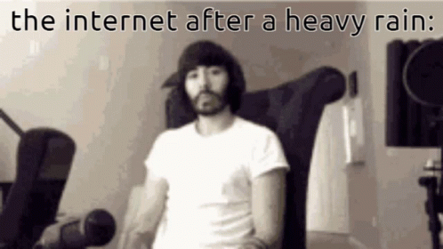 Bearded Man in Chair With Text The Internet After a Heavy Rain