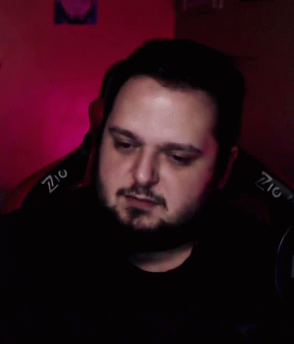 Bearded Man In Chair With Z On Back GIF
