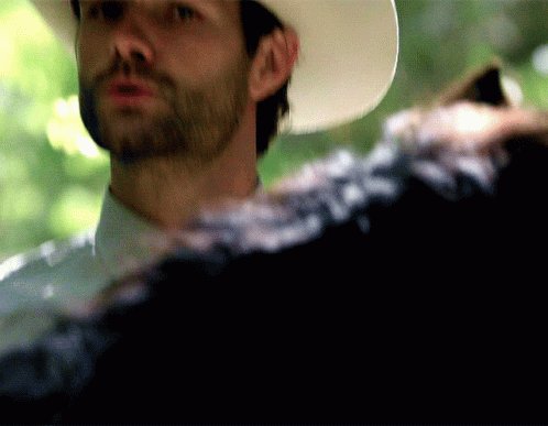 Bearded Man in Cowboy Hat Looking