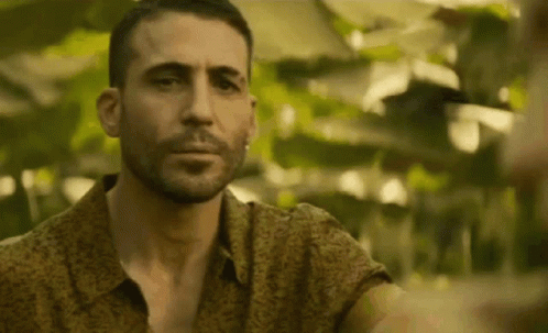 Bearded Man in Floral Shirt Looking at Camera