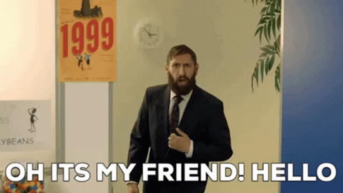 Bearded Man in Front of 1999 Sign