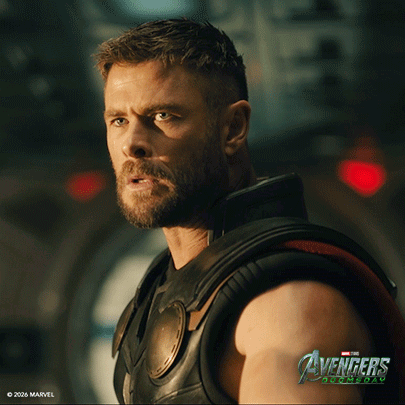 Bearded Man In Front Of Avengers Age Of Ultron Sign GIF