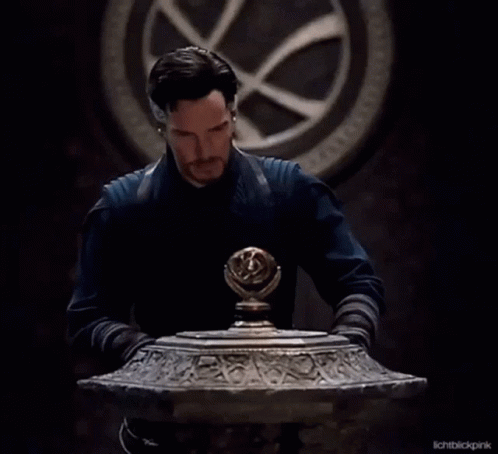 Bearded Man in Front of Clock Looking