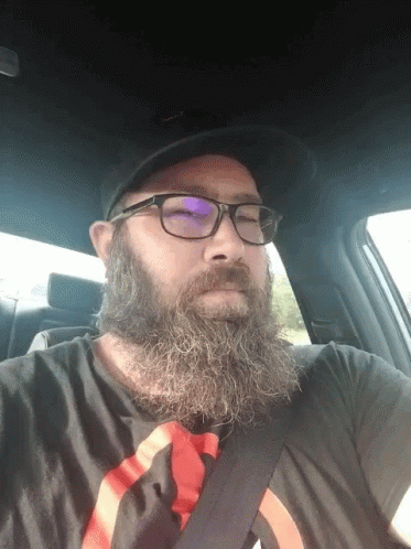 Bearded Man in Glasses and Black Hat