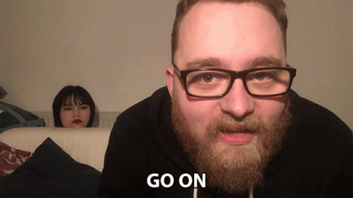 Bearded Man in Glasses Tells Woman Go On