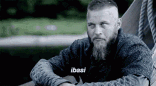 Bearded Man In Hammock Hands On Hips GIF