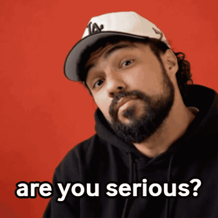 Bearded Man in Hat and Black Hoodie Asking Are You Serious