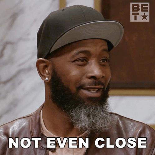 Bearded Man in Hat and Leather Jacket Saying Not Even Close