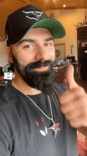 Bearded Man in Hat Giving Thumbs Up