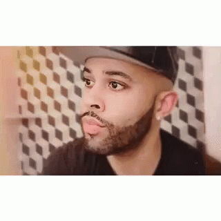 Bearded Man in Hat Looking at Camera