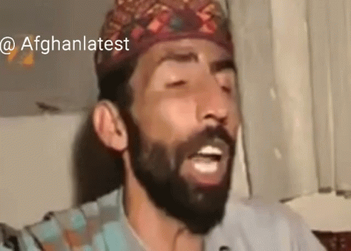 Bearded Man In Hat Singing Into Microphone GIF