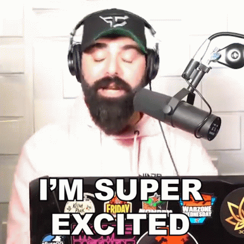 Bearded Man in Headphones and Hat Says I'm Super Excited