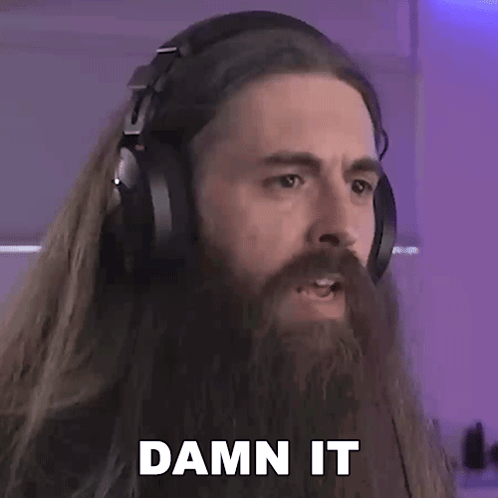 Bearded Man in Headphones Making Funny Face