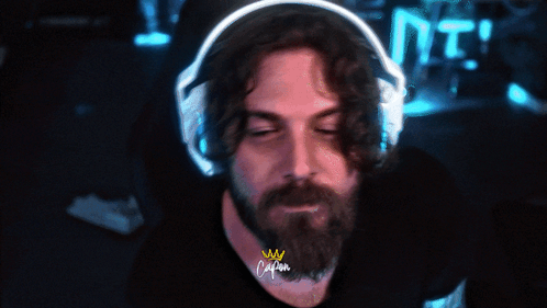 Bearded Man in Headphones With Crown Shirt