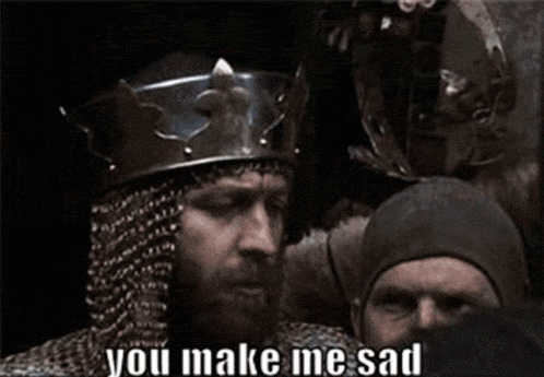 Bearded Man in Helmet and Chain Mail Says You Make Me Sad
