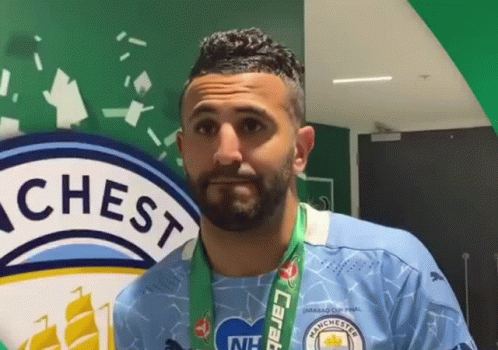 Bearded Man in Manchester City Jersey