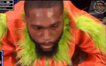 Bearded Man in Orange Green Fur Coat and Scarf