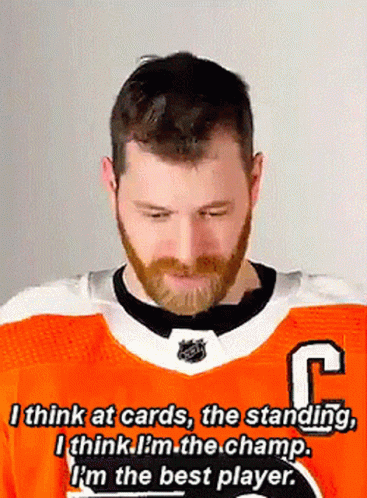 Bearded Man in Orange Jersey With R