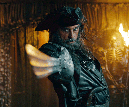 Bearded Man in Pirate Hat Pointing