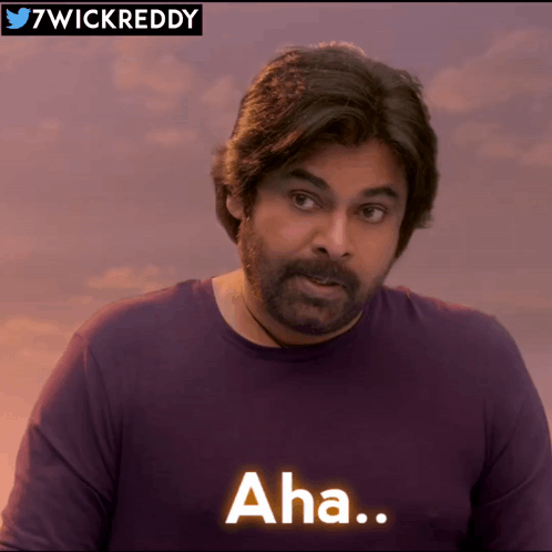 Bearded Man in Purple Shirt Saying Aha