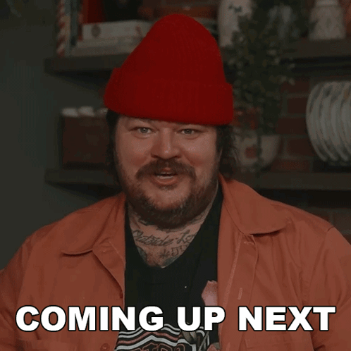 Bearded Man in Red Beanie Says Coming Up Next