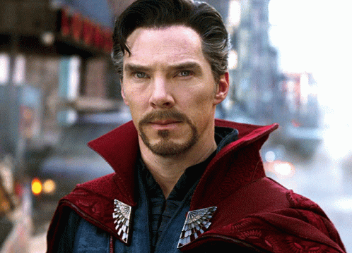 Bearded Man In Red Cape And Silver Brooch GIF