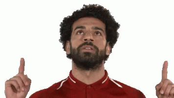 Bearded Man in Red Shirt Pointing Up