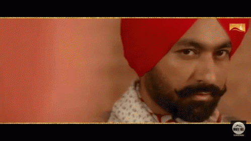 Bearded Man In Red Turban And White Shirt GIF