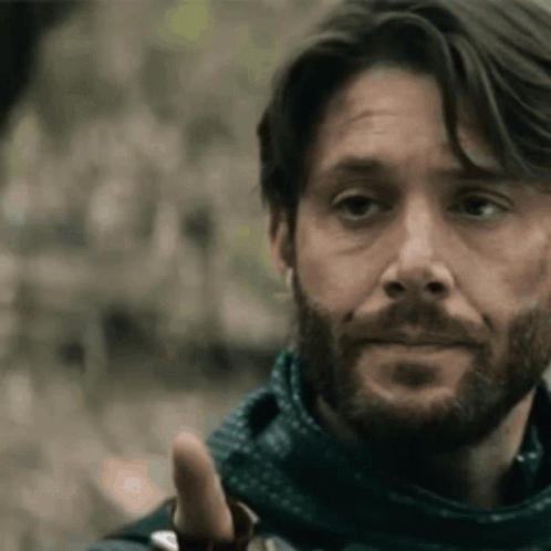 Bearded Man in Scarf Giving Thumbs Up