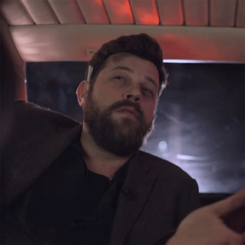 Bearded Man in Suit and Black Shirt
