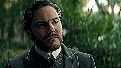 Bearded Man in Suit and Tie Looking at Camera