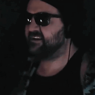 Bearded Man in Sunglasses and Black Tank Top