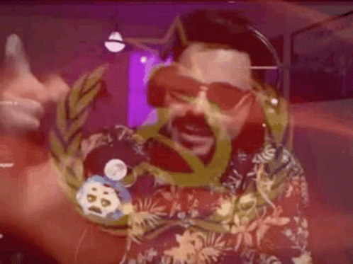 Bearded Man in Sunglasses and Hawaiian Shirt Holding Medal
