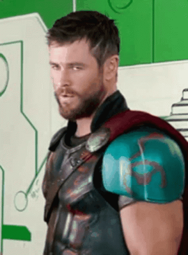 Bearded Man in Superhero Costume Looking at Camera