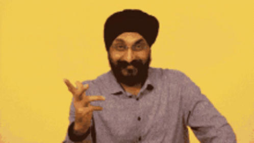 Bearded Man in Turban and Glasses Peace Sign