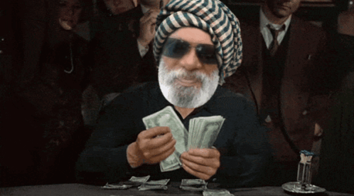 Bearded Man in Turban Holding Money
