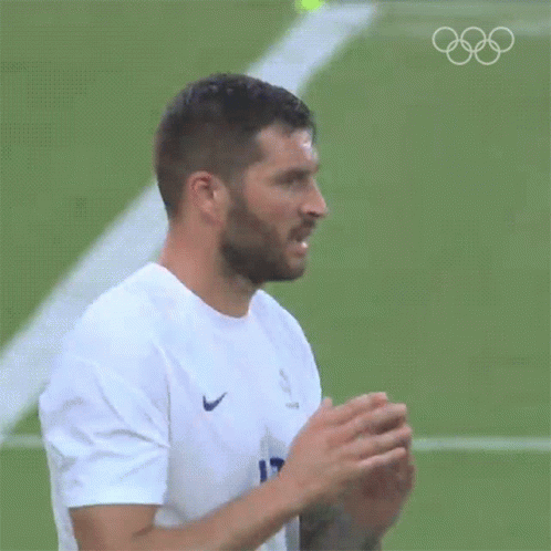 Bearded Man in White Nike Shirt on Soccer Field