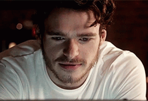 Bearded Man In White Shirt Looking GIF