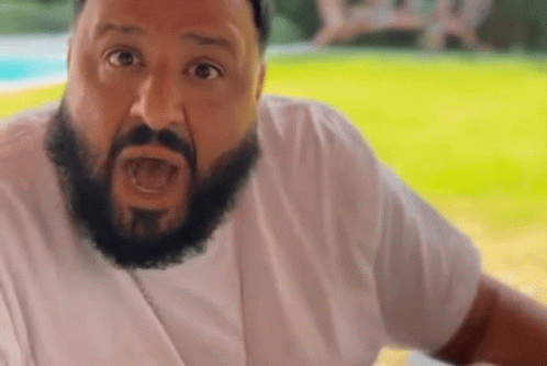 Bearded Man in White Shirt Making Funny Face