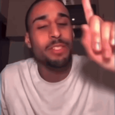 Bearded Man in White T-Shirt Giving Middle Finger