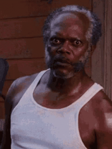 Bearded Man In White Tank Top Making Funny Face GIF