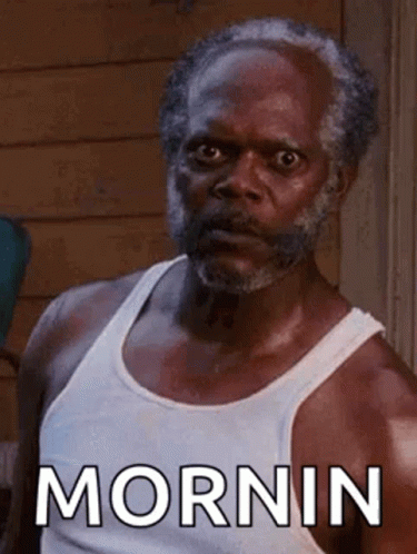 Bearded Man in White Tank Top Saying Morning