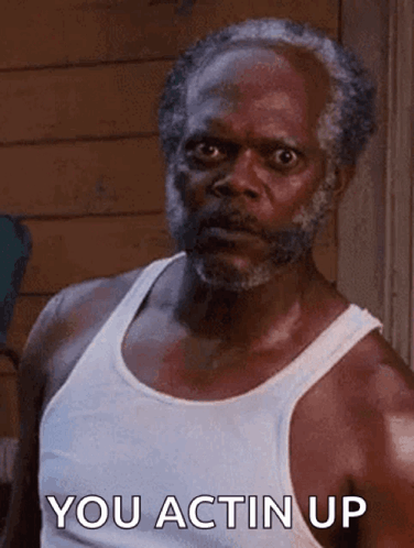 Bearded Man in White Tank Top You Actin Up