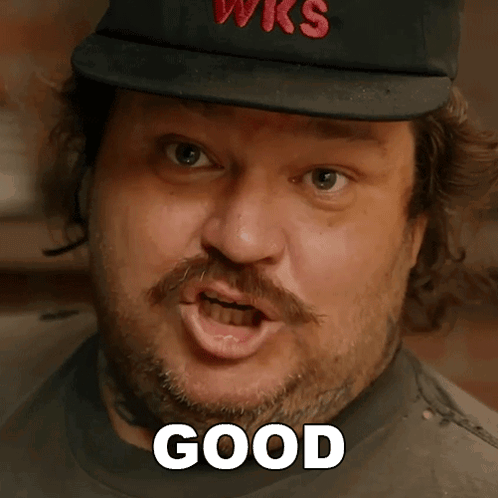 Bearded Man in Wks Hat Saying Good