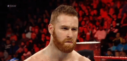 Bearded Man in Wrestling Ring With Crowd