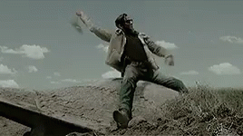 Bearded Man Jumping in Field