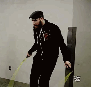 Bearded Man Jumping Rope Near Yellow Tape Measure