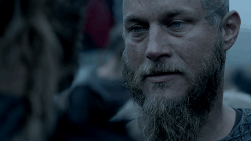 Bearded Man Looking At Another Man GIF